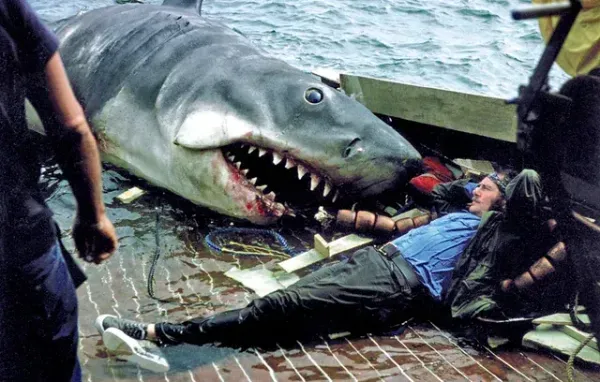 Quint (Robert Shaw) and The Shark (Bruce) relax between takes on the set of Jaws.